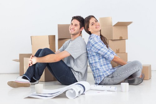 Professional movers unloading household items at a Sydenham property