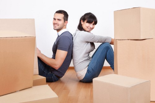 Unpacking and arranging boxes in a Sydenham property after the move