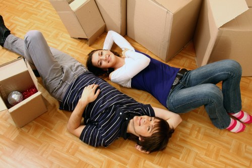 Professional removals team handling household boxes and furniture in Sydenham