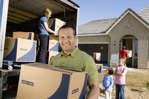 A van being loaded with furniture for a Sydenham moving job